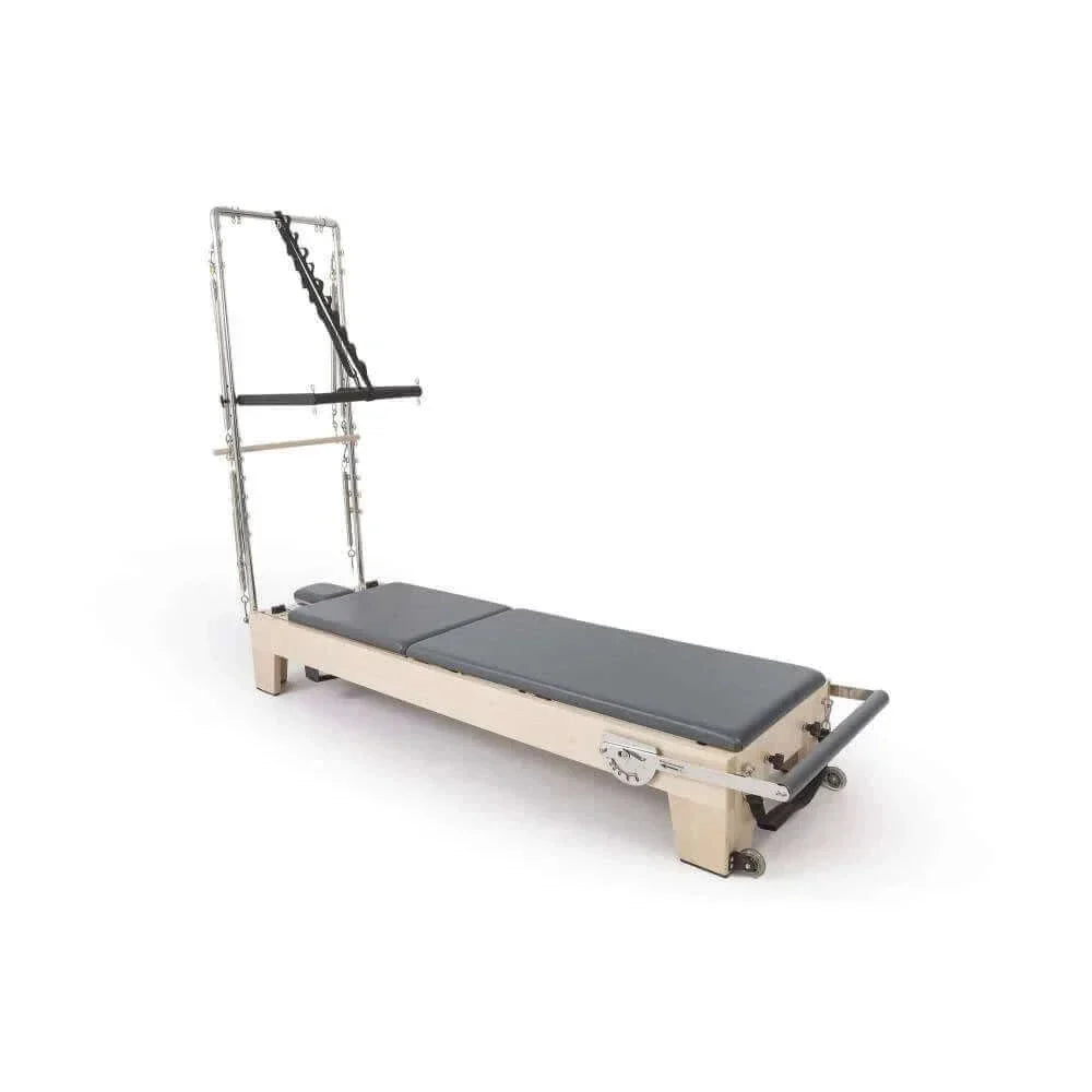 Reformer Pilates Elite en bois d'érable avec coussins gris foncé et configuration compacte