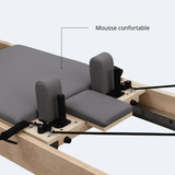 Détail siège mousse confortable gris foncé revêtement texturé coussins latéraux reformer Pilates